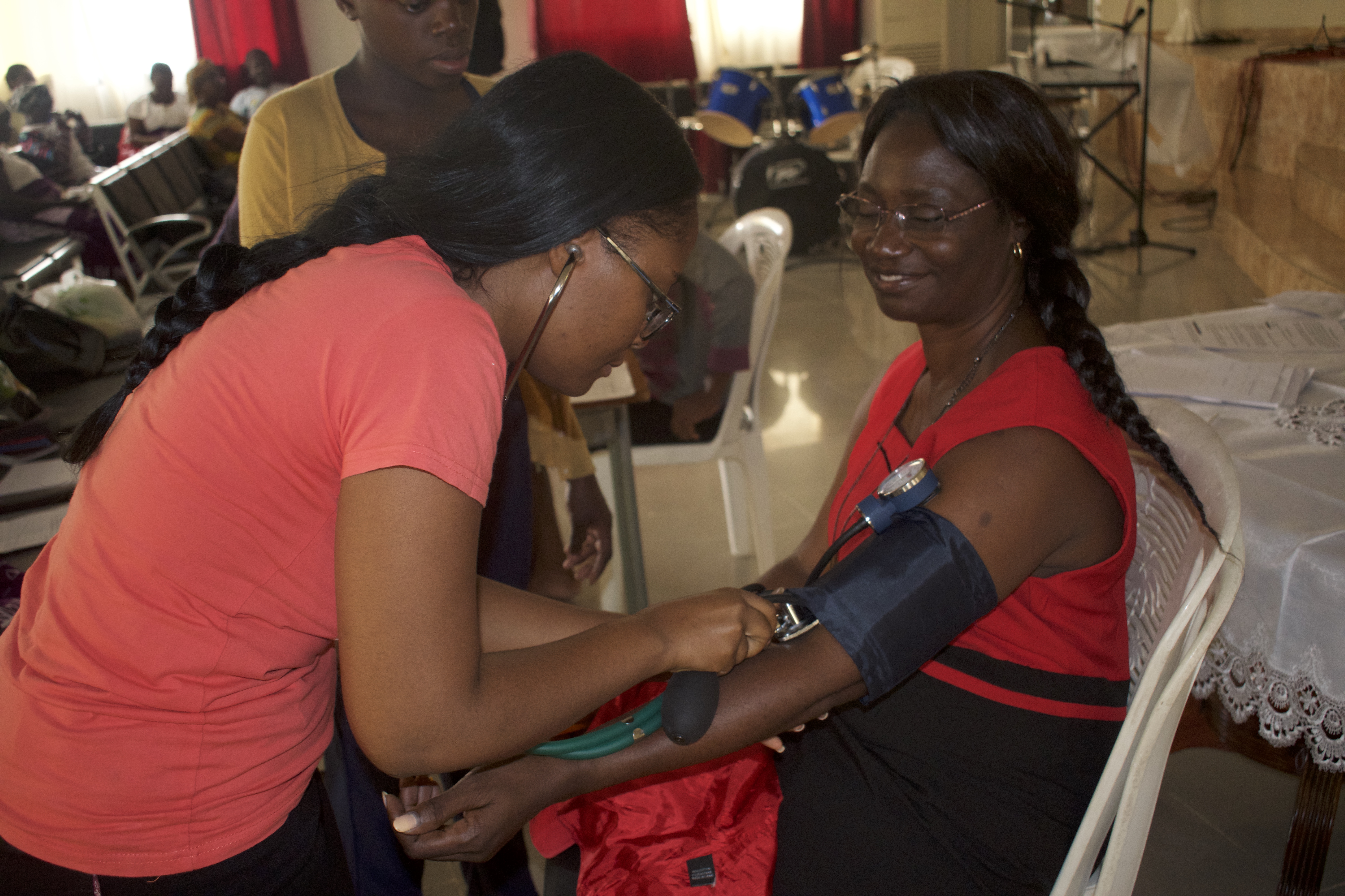 A volunteer medical student assessing the blood pressure